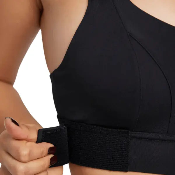 Faixa lateral do soutien desportivo preto com fecho em velcro para ajuste firme.