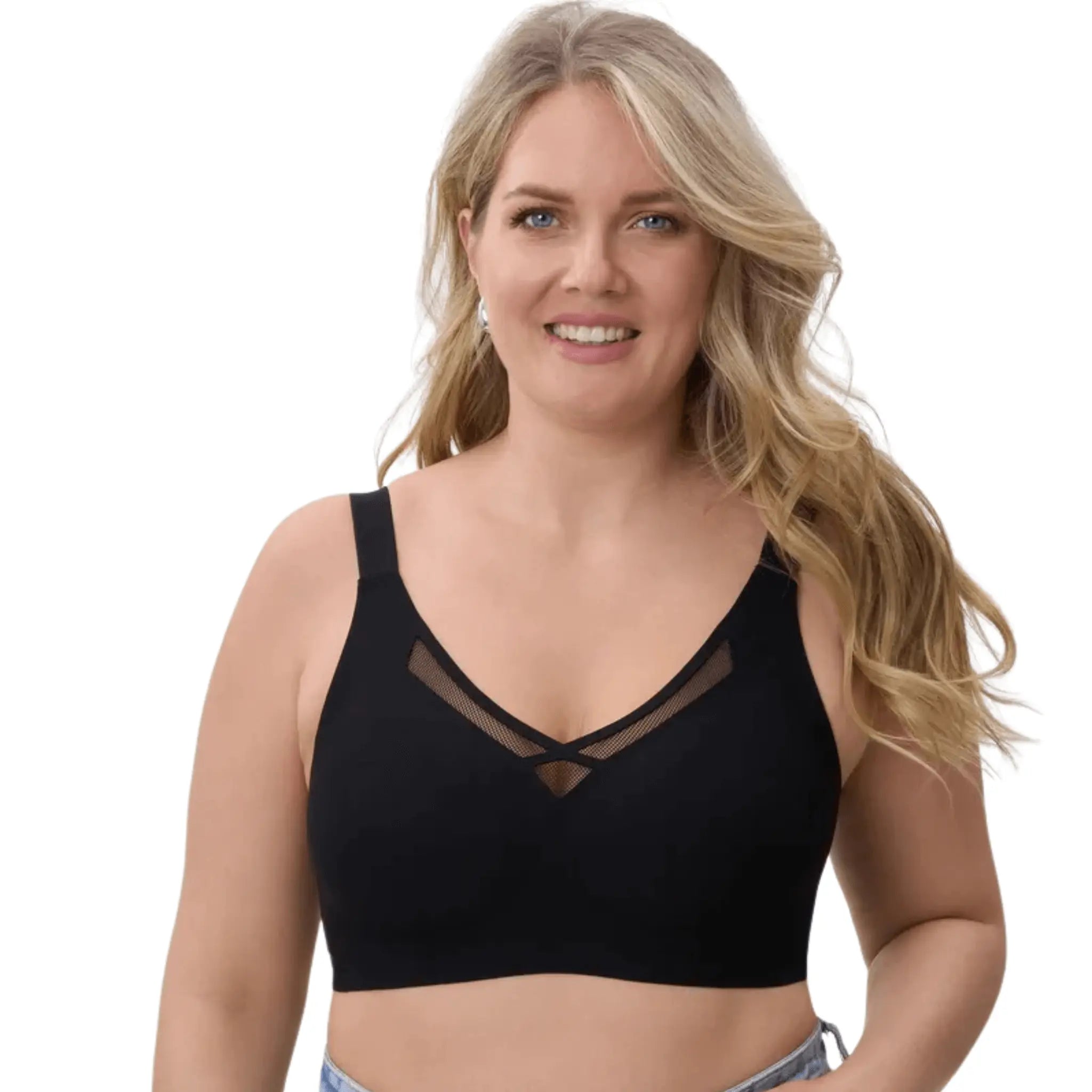 Mulher sorrindo, usando soutien preto redutor, com detalhe de tela no decote.