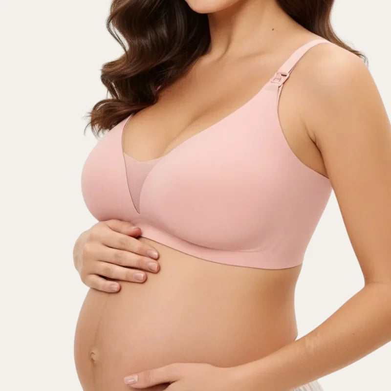 Vista lateral do soutien para amamentar Serene rosa, mostrando as laterais largas e a adaptação ao corpo durante a gravidez.